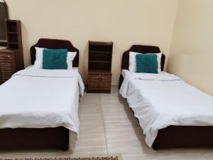 Ένα ή περισσότερα κρεβάτια σε δωμάτιο στο Salassel Al Jabal Al Akhdar Guesthouse