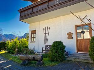 a house with a wooden door on the side of it at Ferienwohnung Zirbenblüte in Schönau am Königssee