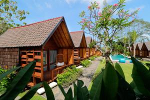 a row of cottages at a resort at Bingin Lodge Uluwatu in Uluwatu