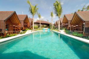 an image of a swimming pool at a resort at Bingin Lodge Uluwatu in Uluwatu