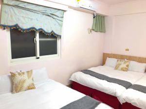 A bed or beds in a room at Chia Yun Homestay