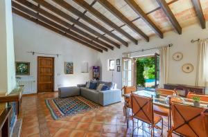 a living room with a couch and a table at Agroturismo SAIGO in Portocolom