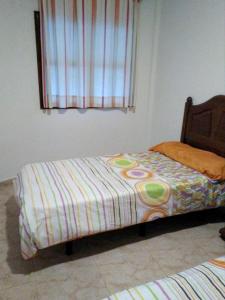 Łóżko lub łóżka w pokoju w obiekcie One bedroom apartement with sea view furnished terrace and wifi at Villa de Mazo