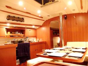 a kitchen with a table with glasses on it at Charming Boat in Funchal with Sea View in Funchal
