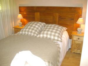 a bedroom with a bed with two night stands and two lamps at Maison de 6 chambres avec jardin clos et wifi a Sermersheim in Sermersheim