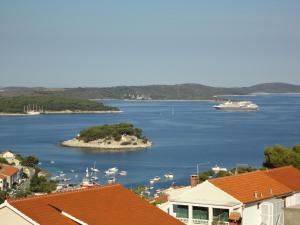 a view of a body of water with boats in it at Apartments Marina in Hvar