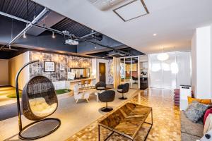 a living room with a couch and a table at Birupaku in Shizuoka