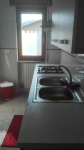 a kitchen with a stove and a sink at One bedroom apartement with wifi at Calvello in Calvello