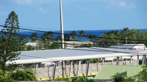 a large white canopy on top of a baseball field at Bungalow charmant à Sainte-Anne in Sainte-Anne +5 photos