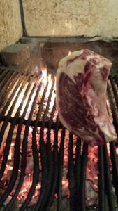 a piece of meat on top of a grill at Albergo Delle Industrie in Casalmaggiore