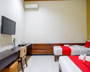 Lova arba lovos apgyvendinimo įstaigoje RedDoorz Plus @ Hotel Asih UNY