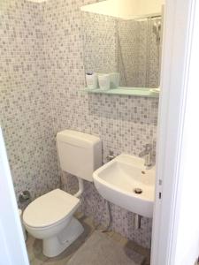 a bathroom with a toilet and a sink at One bedroom appartement at Sanremo 40 m away from the beach with sea view furnished terrace and wifi in Sanremo