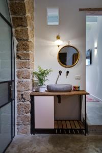 a bathroom with a sink and a mirror at Daya - Old City Acre in Acre