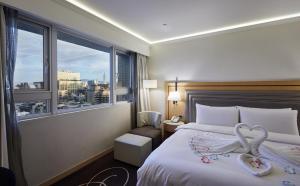 Voodi või voodid majutusasutuse K Hotel Taipei Songjiang toas