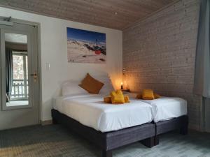 Katil atau katil-katil dalam bilik di Lodge Les Merisiers