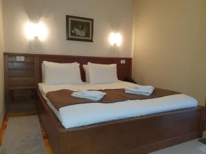 Postel nebo postele na pokoji v ubytování Hotel Tara