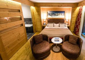 Voodi või voodid majutusasutuse Nendaz 4 Vallées & SPA 4* Superior toas