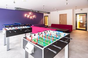 a living room with a pool table and billiards at Apartamenty Collegia in Gdańsk