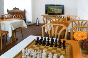 TV a/nebo společenská místnost v ubytování Hotel Hauer