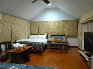 Katil atau katil-katil dalam bilik di Jilufugan B&B