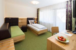 Postel nebo postele na pokoji v ubytování Hotel Rössle