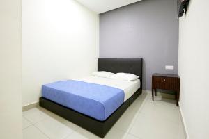Postel nebo postele na pokoji v ubytování Hotel 3Winz, Chow Kit Hospital Kuala Lumpur
