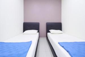Postel nebo postele na pokoji v ubytování Hotel 3Winz, Chow Kit Hospital Kuala Lumpur