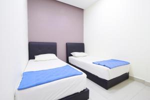 Postel nebo postele na pokoji v ubytování Hotel 3Winz, Chow Kit Hospital Kuala Lumpur