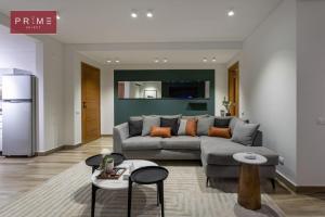 a living room with a couch and a table at Prime Select El Batal in Cairo