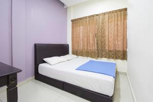 Postel nebo postele na pokoji v ubytování Hotel 3Winz, Chow Kit Hospital Kuala Lumpur