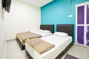 Postel nebo postele na pokoji v ubytování Hotel 3Winz, Chow Kit Hospital Kuala Lumpur
