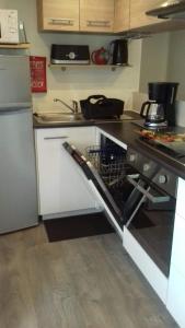 a kitchen with a sink and a dishwasher at luminosa in Litteau