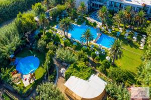 an overhead view of a pool at a resort at May Beach Hotel in Rethymno