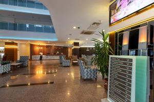 A television and/or entertainment centre at Narcia Resort Side - Ultra All Inclusive