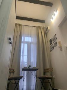 a room with a window with two chairs and a table at Old Town City Center in Belgrade +6 photos