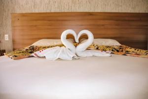 Een bed of bedden in een kamer bij Orla Piaui