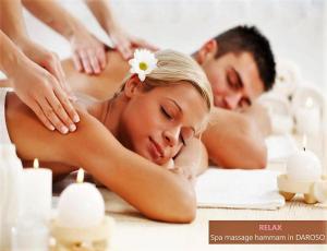 a man and a woman getting a massage in a spa at Hammam Spa Villa DAROSO in Kosiv