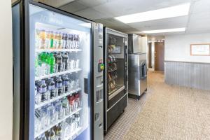 a refrigerator in a room with drinks in it at Quality Inn & Suites in Plattsburgh