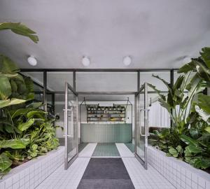 an indoor garden with plants in a building at Kingsland Locke in London