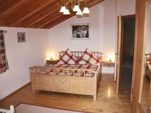 a bedroom with a large bed in a room at Ferienwohnung Brandstetter in Übersee