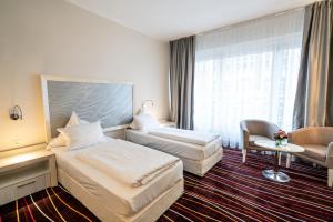 Een bed of bedden in een kamer bij Yors Hotel Hannover City