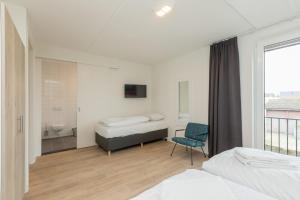 Postel nebo postele na pokoji v ubytování Luxe appartement voor 3 personen