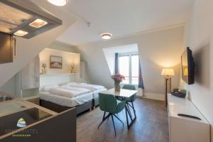 Μια τηλεόραση ή/και κέντρο ψυχαγωγίας στο Luxe studio voor 2 personen