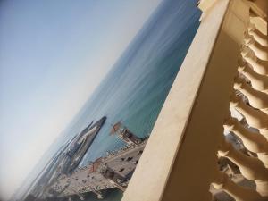 a view of the ocean from a building at Stanley Bridge Apartment in Alexandria