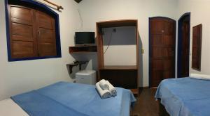 Postel nebo postele na pokoji v ubytování Pousada Manacá Paraty