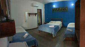 Postel nebo postele na pokoji v ubytování Pousada Manacá Paraty
