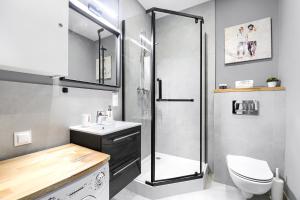 Kúpeľňa v ubytovaní MARGI Igram Apartament + 12 fotografií