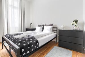 Кровать или кровати в номере Apartament Absynth