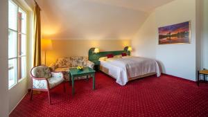 Ein Bett oder Betten in einem Zimmer der Unterkunft Hotel Drachenwand-Mondsee