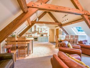 a large living room with a table and chairs at Lady Pond Retreat in Ashbourne